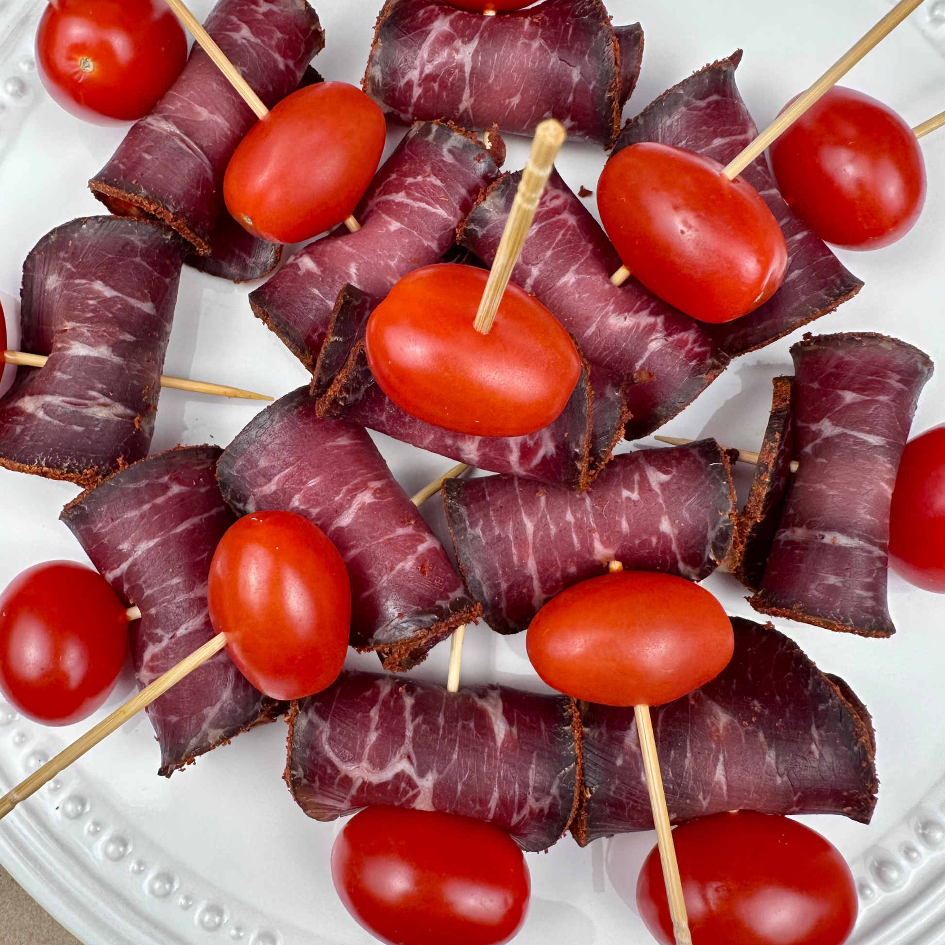 Basturma beef rolls with cherry tomatoes on skewers – appetizer by Papa Did It