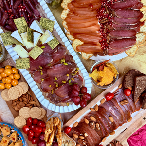 Papa Did It Meat Party Box — 5 hickory-smoked meats served on charcuterie board with nuts, cheese, grapes, and crackers.