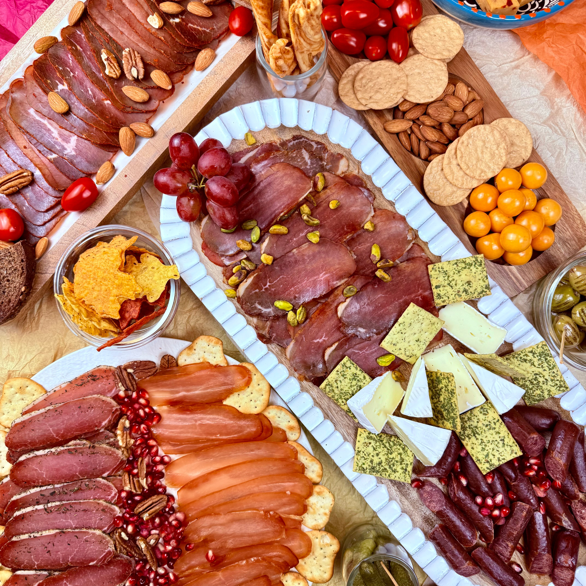 Papa Did It Meat Party Box packaging — five USDA-inspected hickory-smoked meats: turkey balyk, pork loin, basturma, beef prosciutto, and beef sticks.