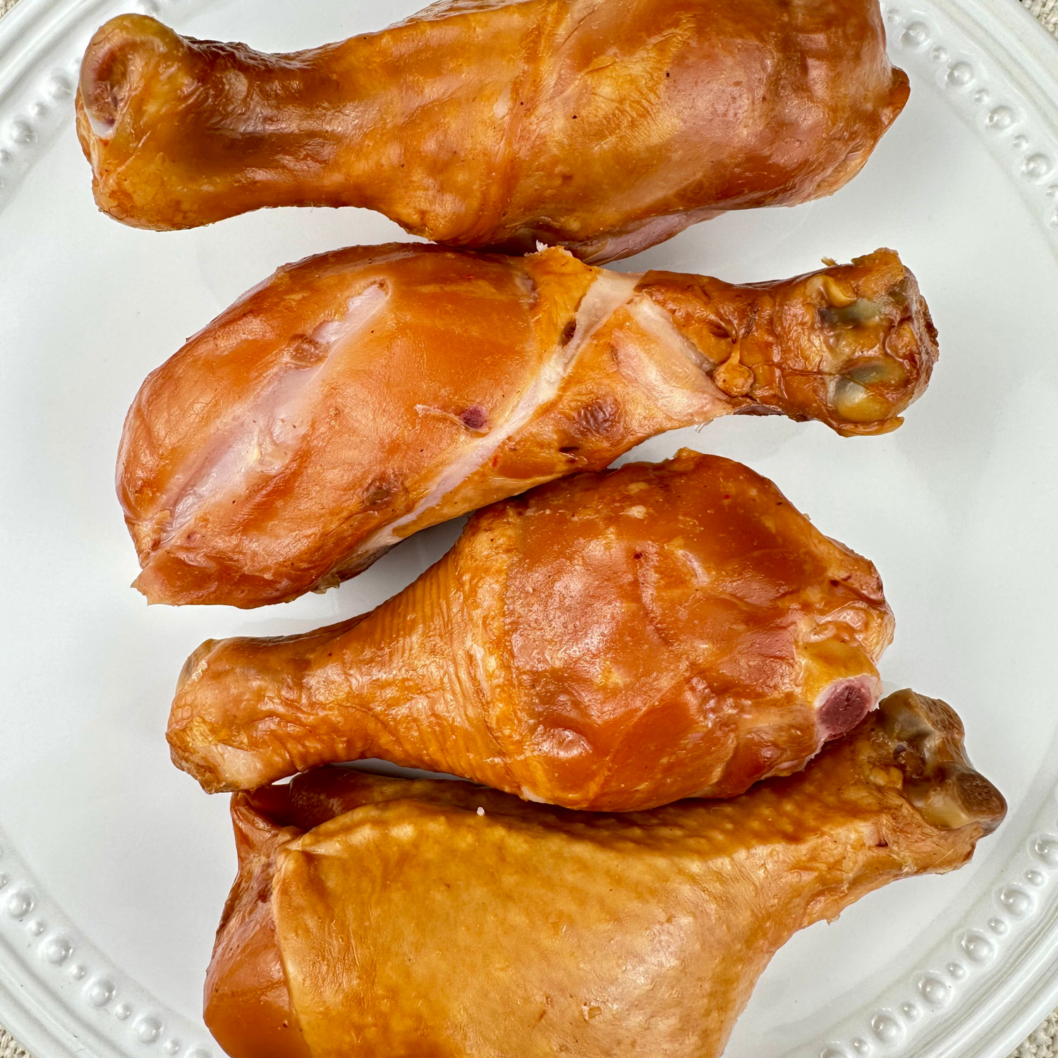 Close-up of sliced smoked chicken drumstick meat showing texture