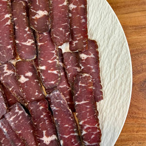 Close-up of Suho Meso dry cured beef showing natural marbling and texture